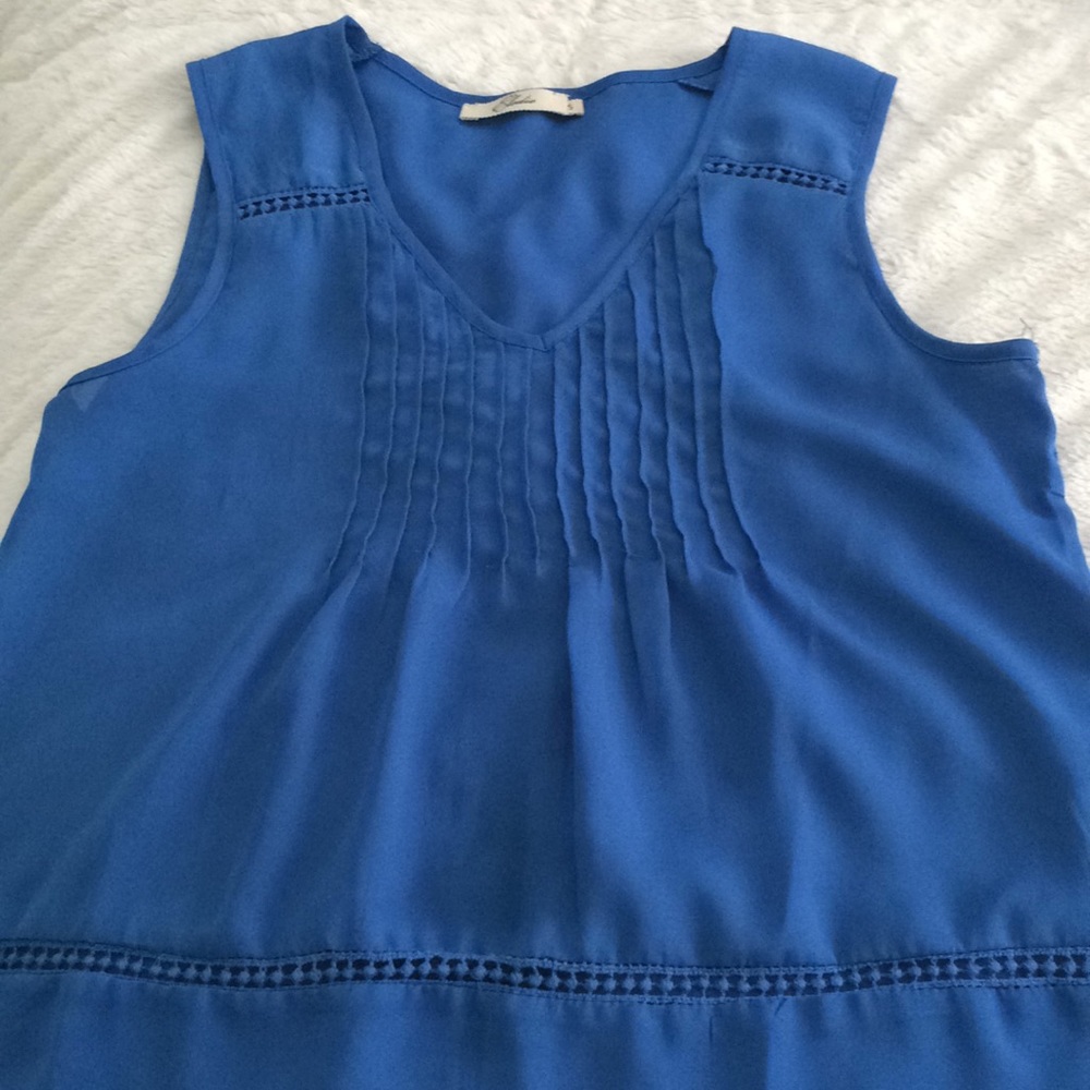 Blue Tank Top with Lace and Ruffle Detailing.